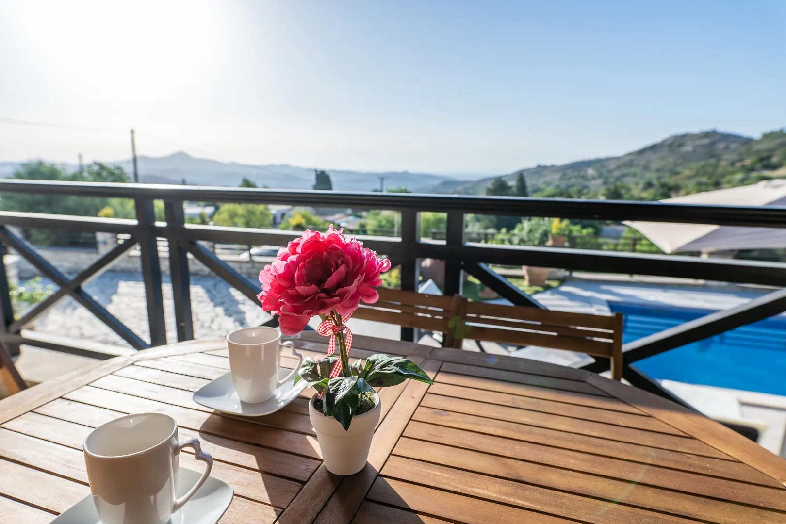 Coffee on the balcony overlooking the pool