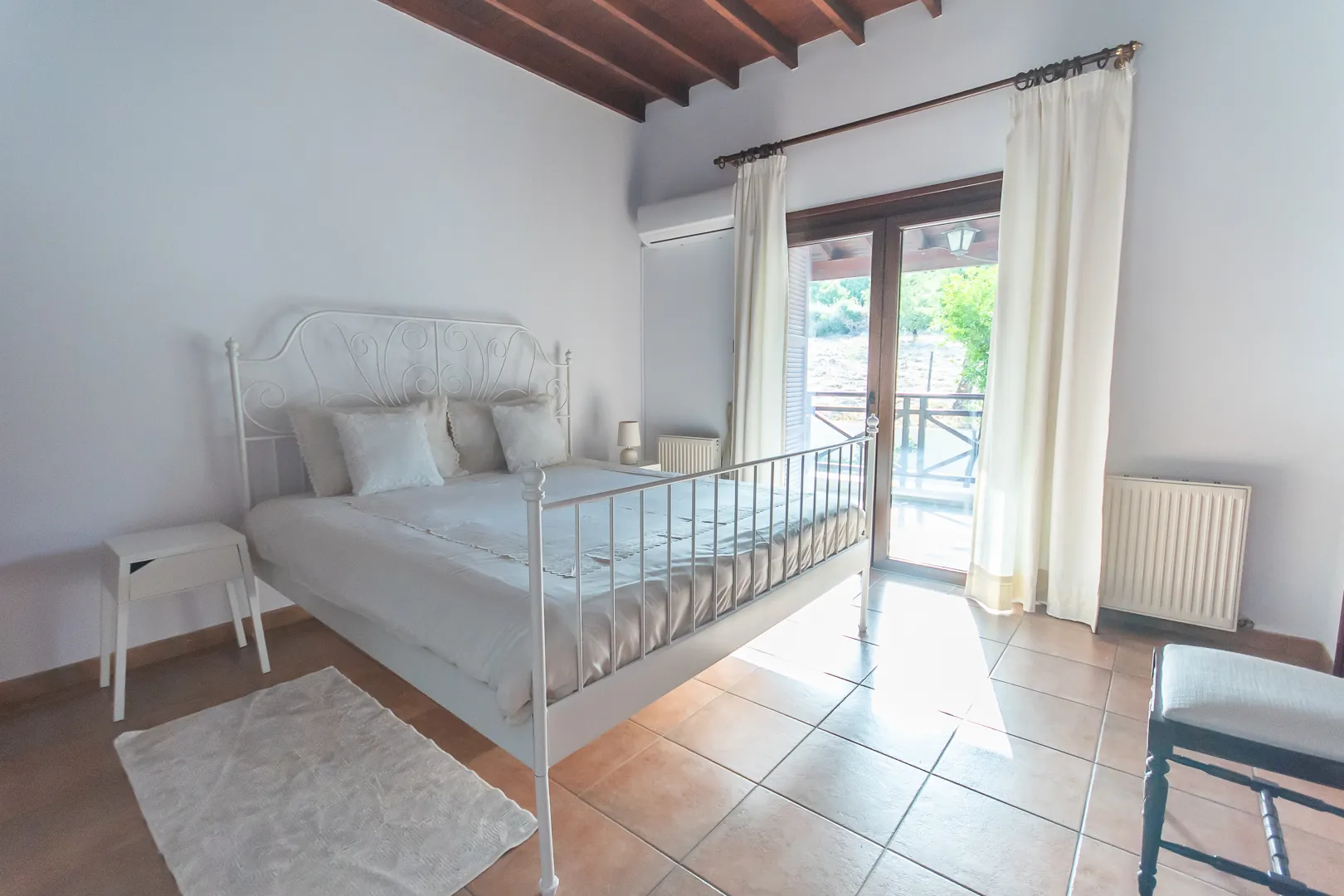 Bright bedroom with balcony door