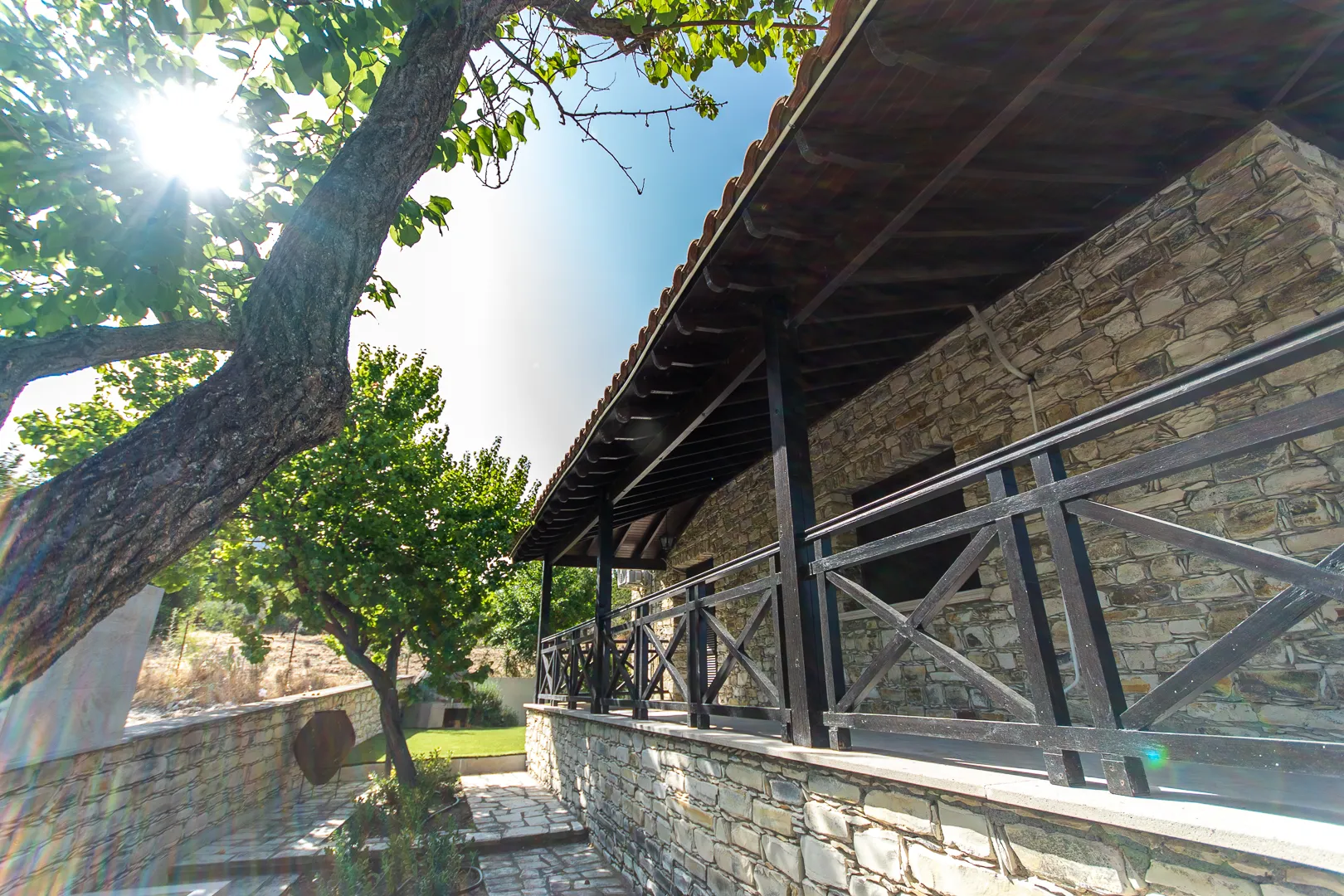 Veranda and garden tree in the sun