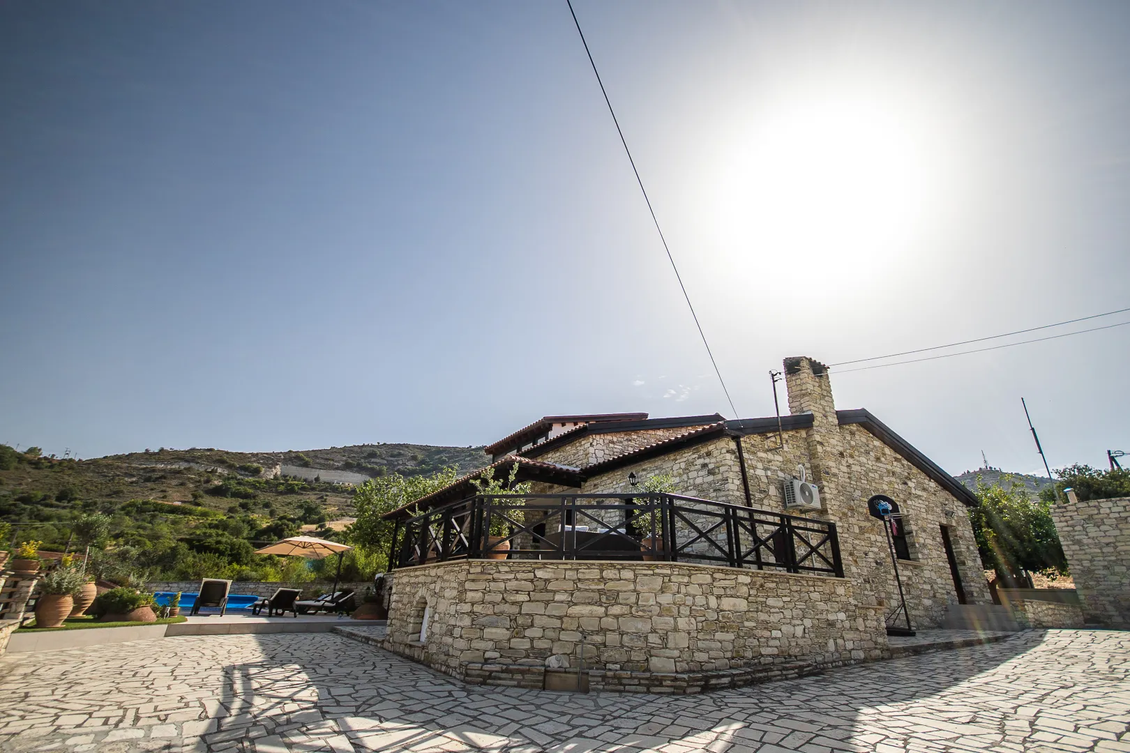 Stone walls and wooden veranda of the villa