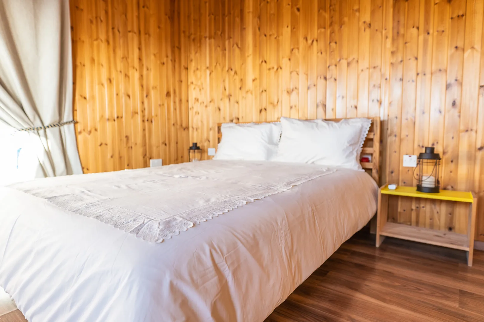 Upstairs double bed with lace bedding